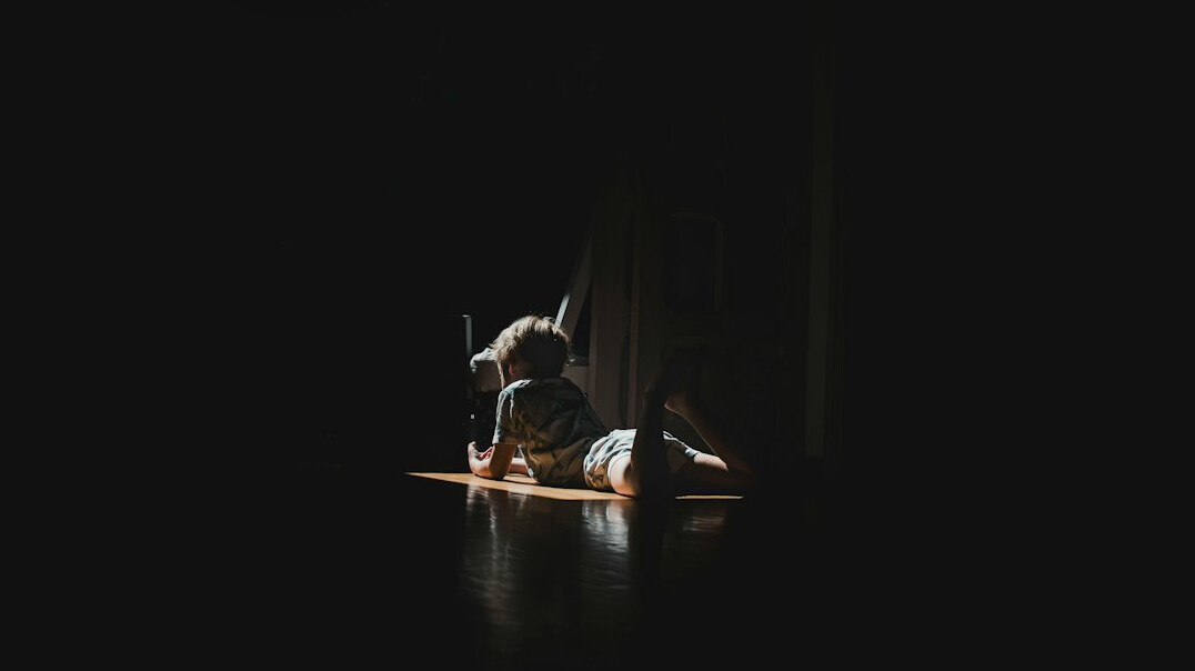 person meditating in quiet room