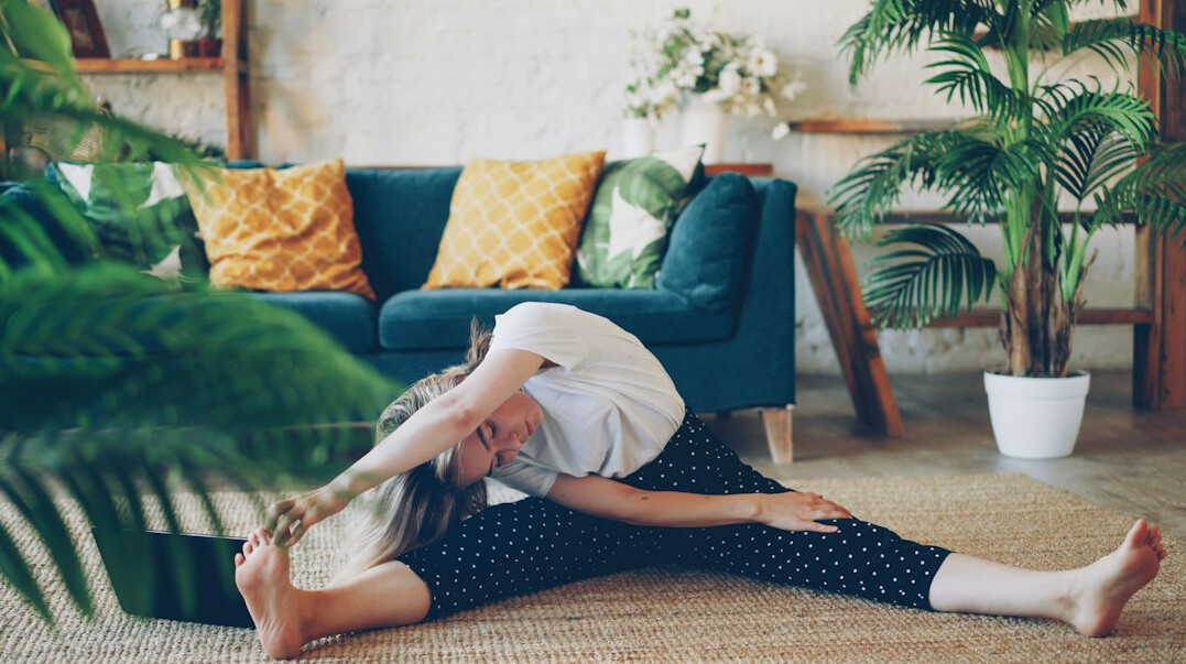 woman stretching at home